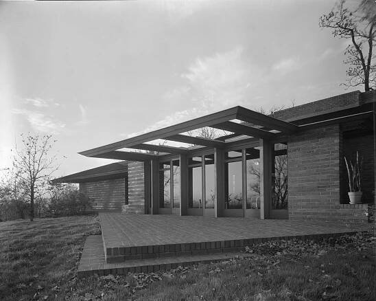 Exterior view of the Malcolm E. Willey residence (255 Bedford Street, SE) in Minneapolis, MN, December 1937. The house, designed by Frank Lloyd Wright, is a single-story, brick house with wood trim on a wooded lot. (Photo by Hedrich Blessing Collection/Chicago History Museum/Getty Images)
