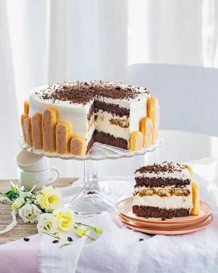 there is a cake on the table with one slice cut out and another half eaten