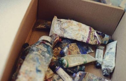 a box of partially used paint tubes that belong to Minneapolis artist James Wrayge