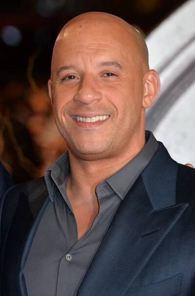 Vin Diesel with a fully-shaved haircut on the red carpet