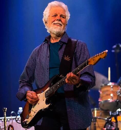 Fred Tackett performs onstage