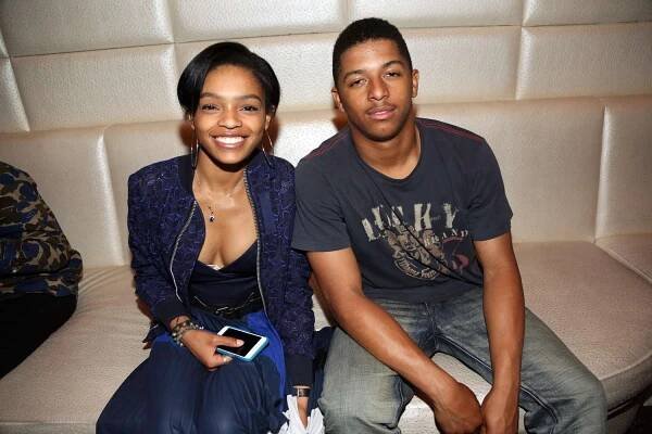 Selah and Zion Marley sitting and smiling for a photo