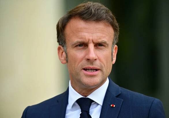 French President Emmanuel Macron addresses the press along with the secretary general of NATO ahead of their meeting at the Élysée Palace on June 28 in Paris.