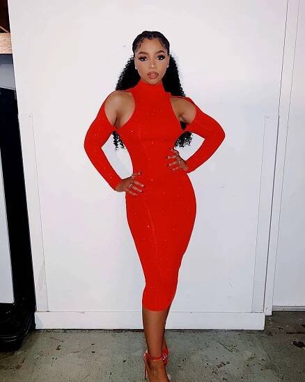 Chloe Bailey Is All 'Fired Up' While Striking a Pose in Sexy Red Bodycon Dress