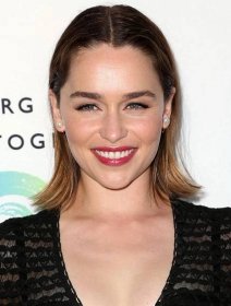 Emilia Clarke center parts her hair to show off her iconic eyebrows