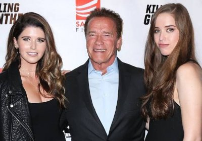 The Terminator star smiles between daughters Katherine and Christina Schwarzenegger