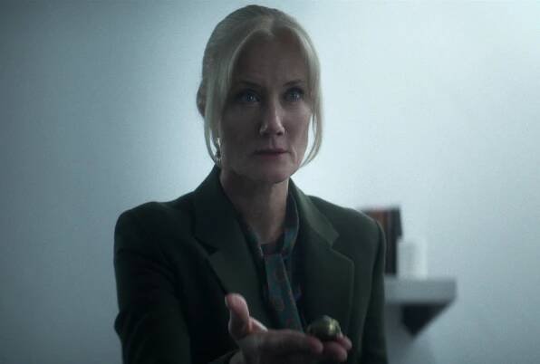 Joely Richardson as Ethel Cripps in 'The Sandman' cast. She's holding out an artifact in the photo.