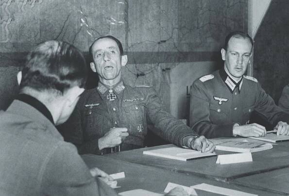 A plenipotentiary for the Wehrmacht and another for the SS (above, center and right) assemble in Caserta, Italy, to sign the surrender documents. Another plus from Wolff: hundreds of Italian paintings were kept out of German hands, avoiding the fate of those below. (Mondadori via Getty Images)