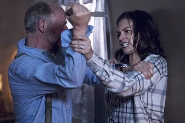 Xander Berkeley wields a sharp object against Lauren Cohan in the Season 9 premiere of "The Walking Dead."