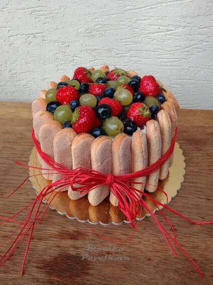 a cake that has fruit on top of it