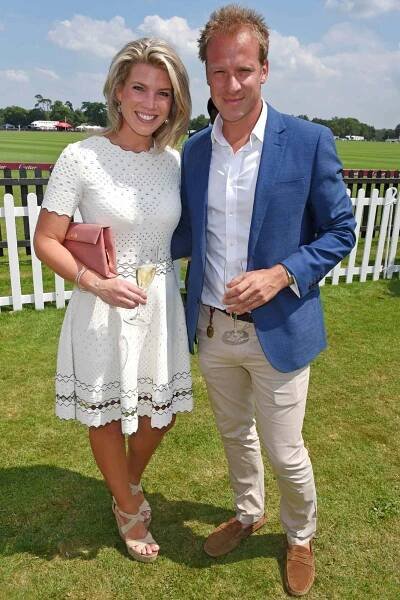 Natasha Archer (L) and Chris Jackson attend the Cartier Queen's Cup Polo final at Guards Polo Club on June 18, 2017 in Egham, England.