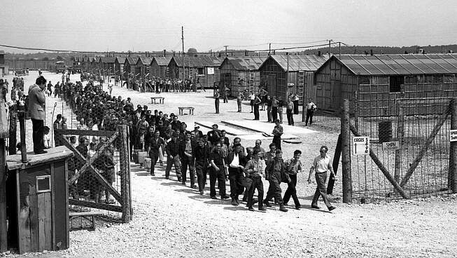 GALERIE: První koncentrační tábor v Dachau otevřel brány v březnu 1933. Připomeňte si jeho hrůzy