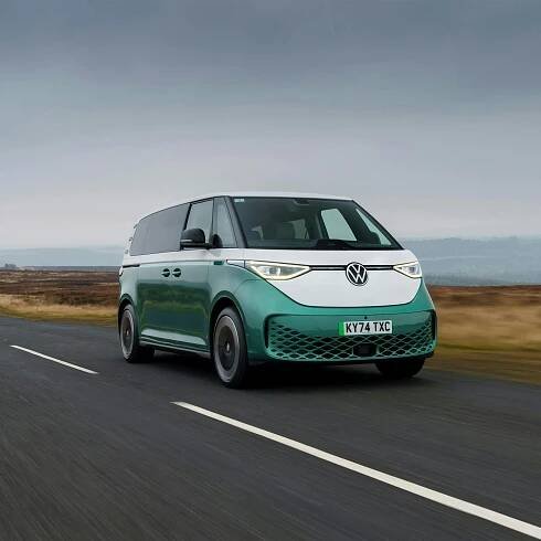 2025 Volkswagen ID. Buzz LWB, RHD, green and white, exterior front three quarter view driving