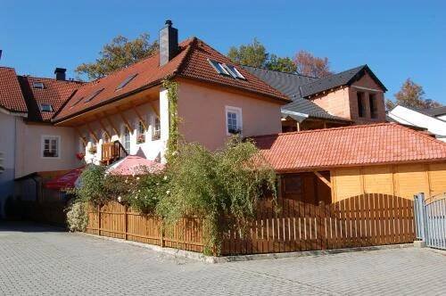 a house with a fence in front of it at Penzion Markus - Pivovar - Brewery Frymburk in Frymburk