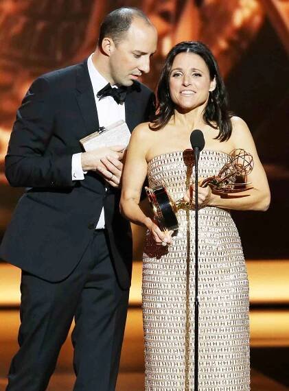 Winner of Best Supporting Actor in a Comedy Series Tony Hale and winner of Best Lead Actress in a Comedy Series, Julia Louis-Dreyfus speak onstage during the 65th Annual Primetime Emmy Awards held at Nokia Theatre L.A. Live on September 22, 2013 in Los Angeles, California. 