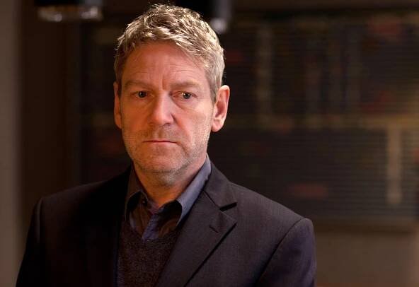 Versatile actor Kenneth Branagh in deep thought Wallpaper