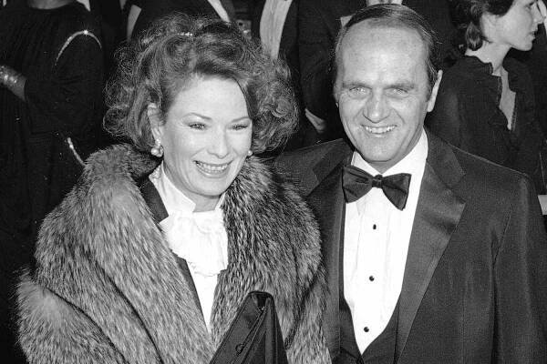 FILE - This Jan. 26, 1985 file photo shows actor-comedian Bob Newhart, right and his wife Ginny at the Golden Globe Awards in Beverly Hills, Calif. Newhart is celebrating his 90th birthday on Thursday, and he’s got big plans: spending the day with his wife of 56 years, Ginnie, and their children. The comedian and actor said he considers laughter the key to longevity in marriage and in life. (AP Photo/Lennox McLendon, File)
