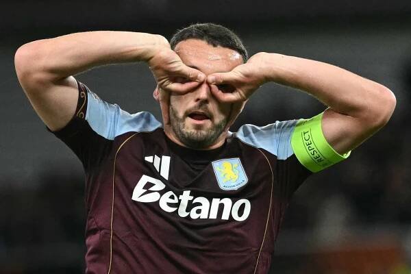 Aston Villa's Scottish midfielder John McGinn celebrates scoring the opening goal during the UEFA Europa League match.