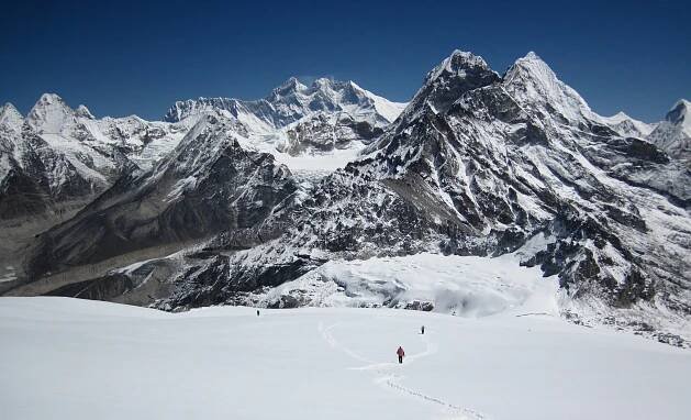 Ascending the slopes of Mera Peak, with huge views to the Everest group