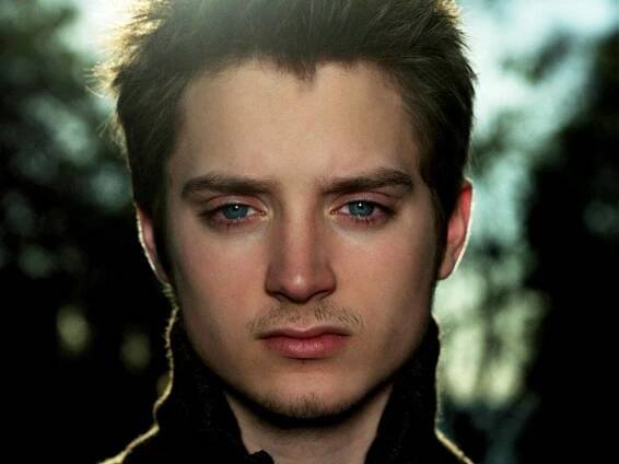 Emotionally Intense Moment with Elijah Wood Wallpaper