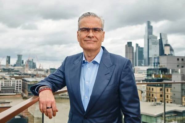 Portrait of Brian McNamara, CEO of Haleon, against the backdrop of the London skyline.