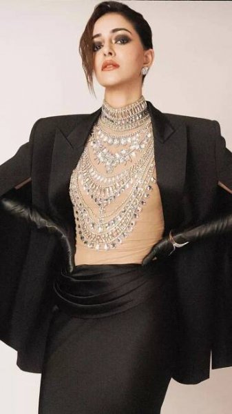 Ananya Panday stuns in a dramatic black gown with a cape blazer and a bedazzled bodysuit