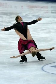 Couple In Ice Skating Competition Wallpaper