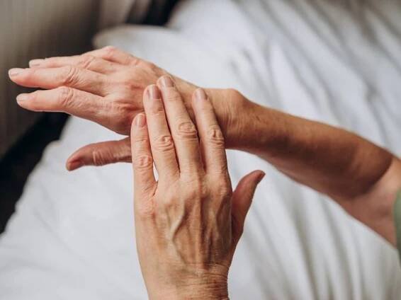 Woman rubbing hand
