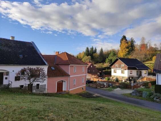 a view of a village with houses and a road at Nad Zlatým Potokem in Kašperské Hory