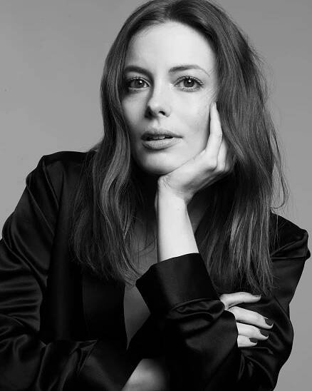 A woman in black shirt and white background