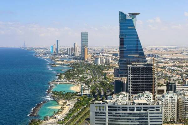 Aerial view of Jeddah, Saudi Arabia, showing the city skyline and coastline.