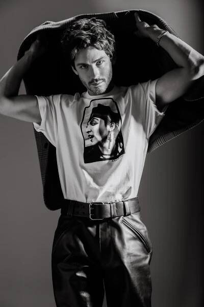 Saint Laurent by Anthony Vaccarello wool jacket and leather pants; Noah x Peter Anderson cotton tee.
