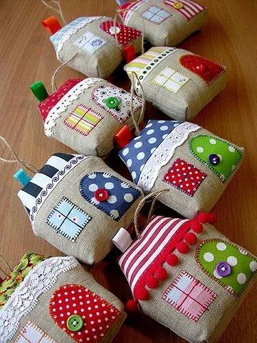 some little houses are hanging from twine