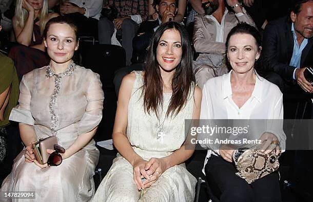 Mina Tander, Bettina Zimmermann and Iris Berben arrive for the Dawid Tomaszewski Show during the Mercedes-Benz Fashion Week Spring/Summer 2013 on...