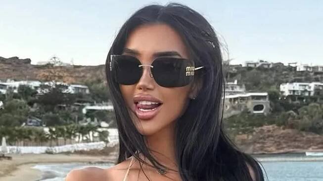 Chloe Khan narrowly avoids a wardrobe malfunction while modelling a barely-there gold bralette during sunshine break in Mykonos
