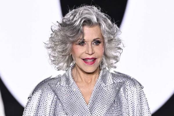 Jane Fonda Sparkles at L'Oreal Paris Fashion Show in Sequined Trench Coat and Silver Sneakers