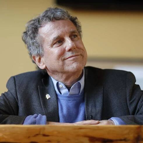 "Ohio Senator Sherrod Brown Smiling During an Event" Wallpaper