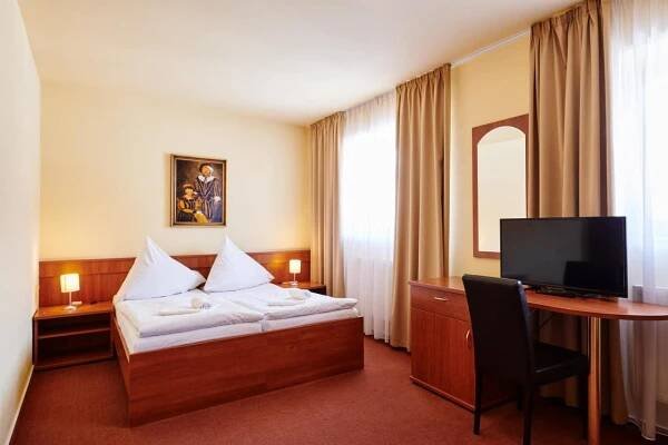 Postel nebo postele na pokoji v ubytování Hotel Zlatá Hvězda