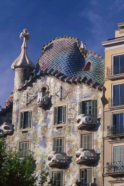 image of the facade of casa batllo with dragon's back roof barcelona spain