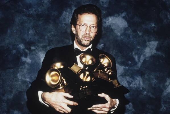 Three-time Rock & Roll Hall of Fame inductee Eric Clapton poses with the six Grammys he won at the 35th annual Grammy Awards. His song "Tears in Heaven" won both as record and song of the year, and his album "Unplugged" won as album of the year, United States, 24th February 1993. The Rock Hall will celebrate "Slowhand" with a two-day fan celebration that coincides with his Sept. 11 concert at Rocket Arena. (Photo by Vinnie Zuffante/Getty Images)