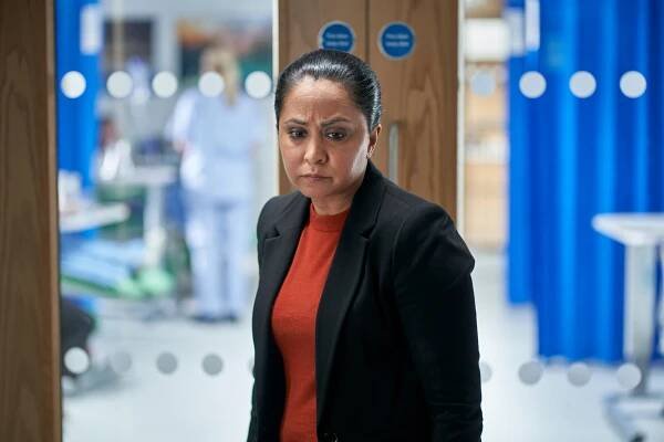 Parminder Nagra as DI Ray in a hospital corridor.