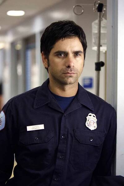 John Stamos as Paramedic Tony Gates on ER