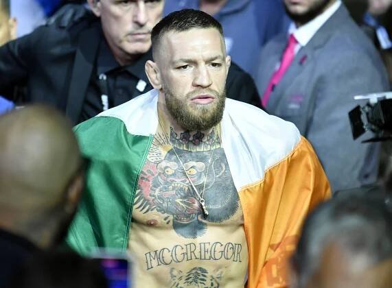Conor McGregor draped in the Irish flag before a UFC fight.