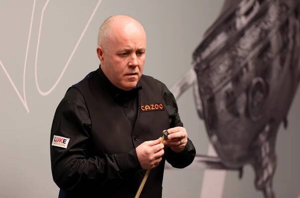 John Higgins of Scotland playing snooker.