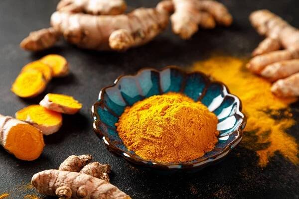 Turmeric. Fresh turmeric root and turmeric, curcumin powder