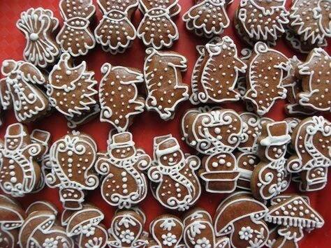some very pretty decorated cookies on a red table