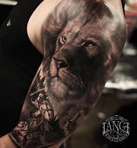 a man with a lion tattoo on his arm