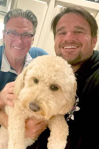Jimmy Connors with his son Brett Connors and dog Isabella in August 2023.