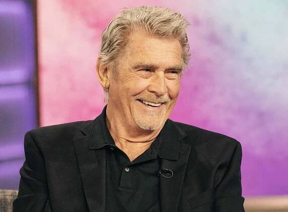 James Brolin smiling wearing a suit jacket