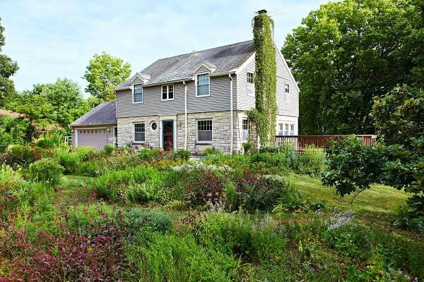 Stone house with floral garden